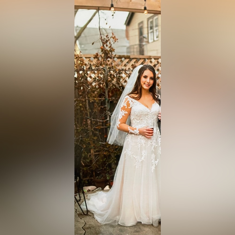 Long sleeve Stella York wedding dress